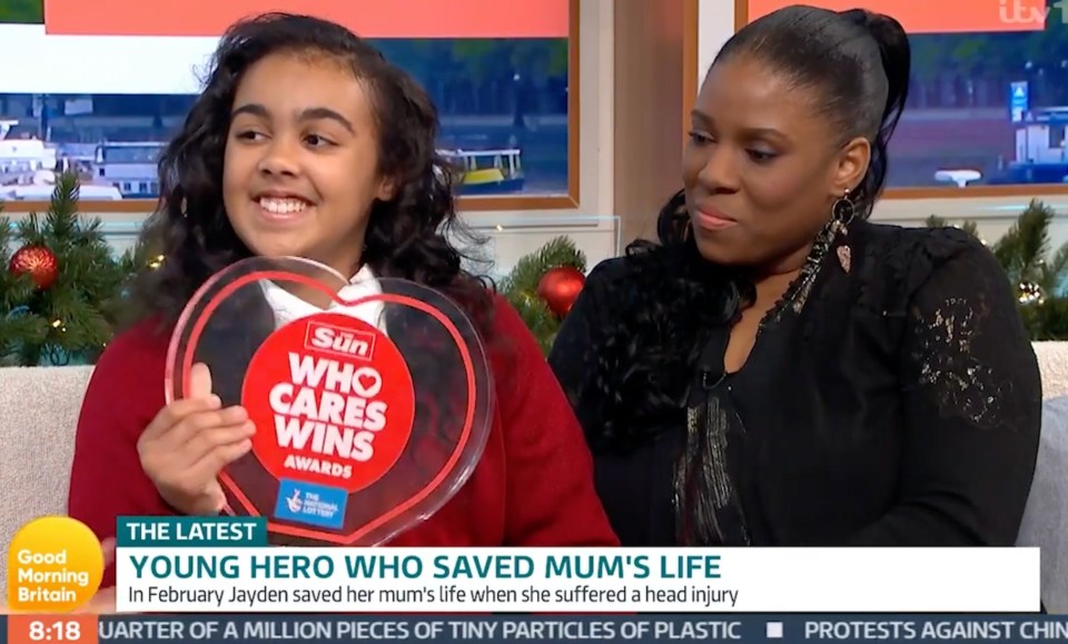Jayden proudly shows off her Who Cares Wins award alongside mum Natasha