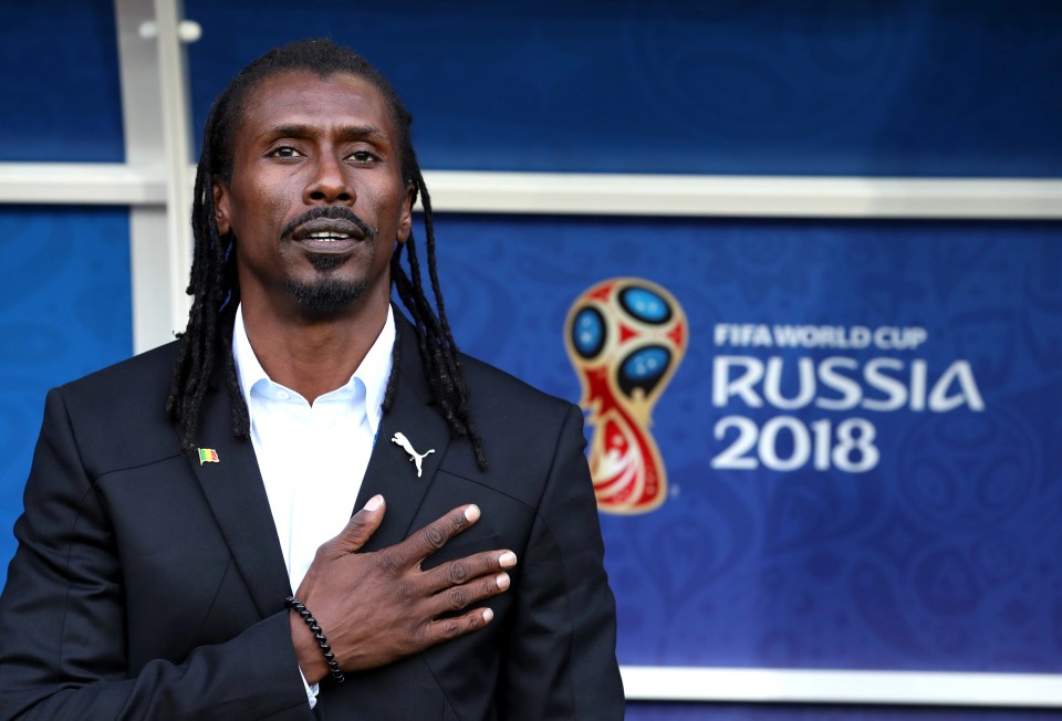 Aliou Cisse, head coach of Senegal sings the national anthem