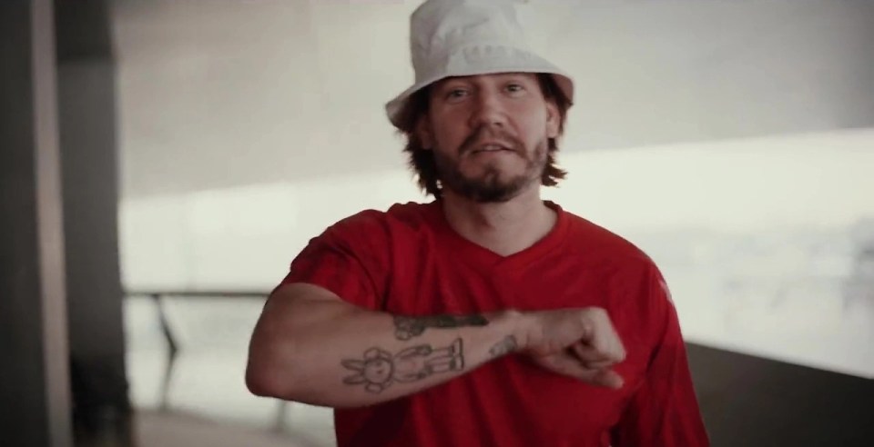 Bendtner was seen with a new hair cut wearing a white bucket hat