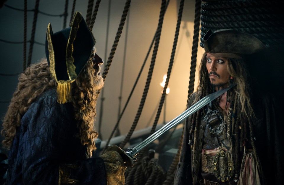 Depp as Sparrow in Dead Men Tell No Tales alongside Geoffrey Rush as Captain Barbossa, left
