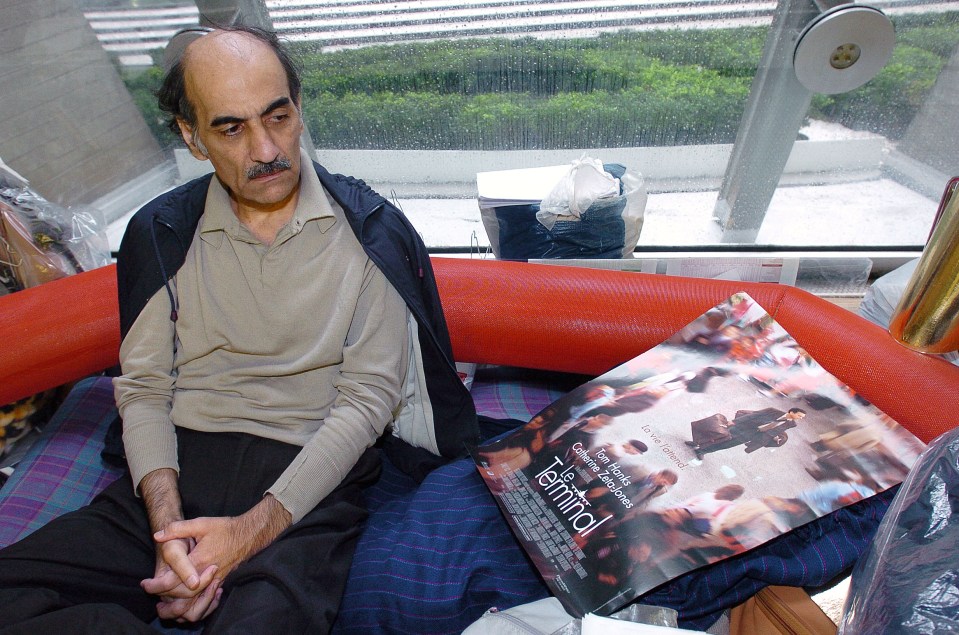 Mehran Karimi Nasseri looks at a poster of the movie inspired by his life