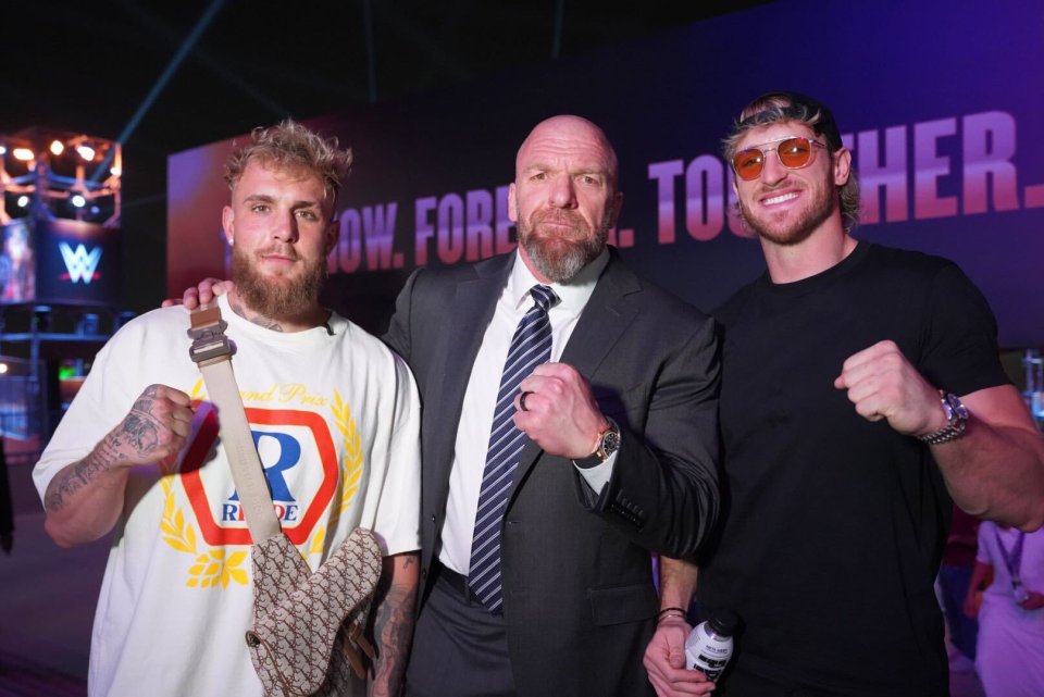 Triple H alongside Jake, left, and Logan Paul