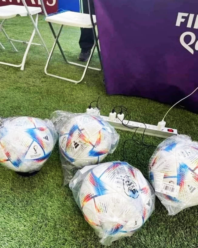 Hi-tech World Cup 2022 footballs being charged before kick-off