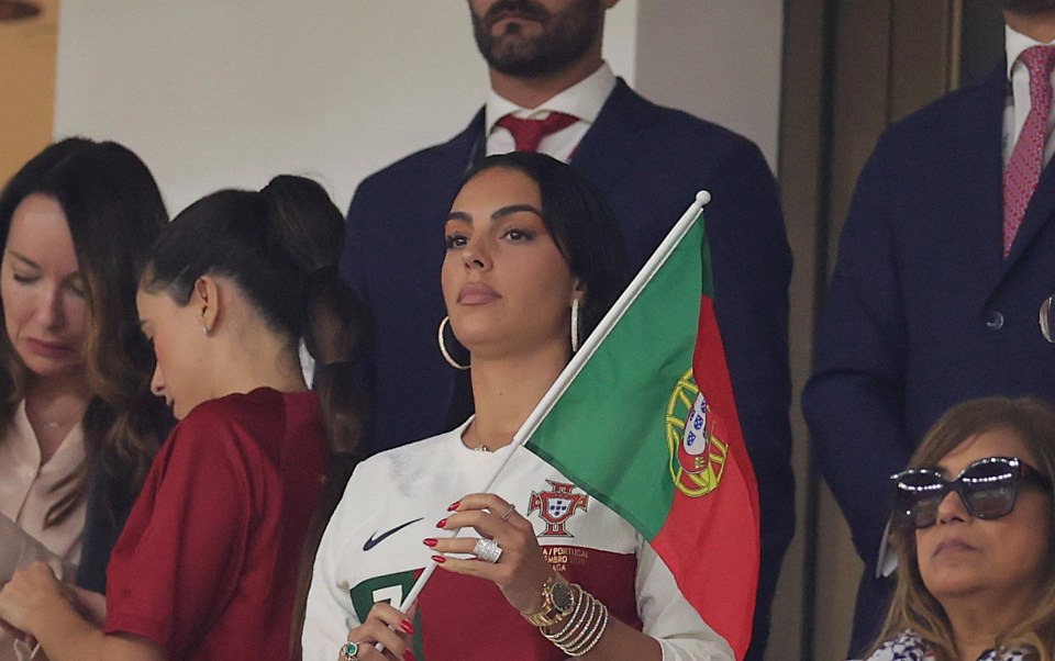 The model was sterned faced as she watched on from the stands