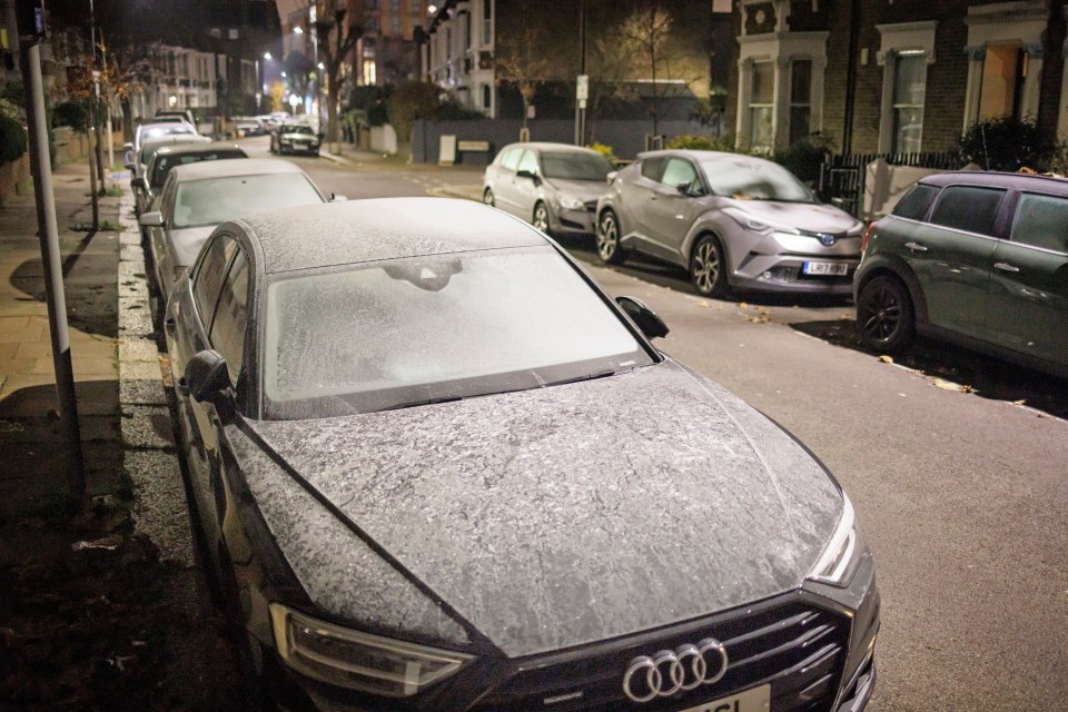 Thick frost covers vehicles in London this morning after temperatures plummeted