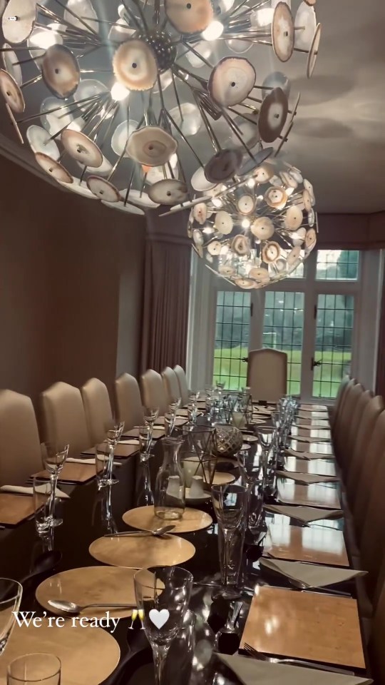 Gemma filmed the family's huge dining table with crystal glasses and gold tableware