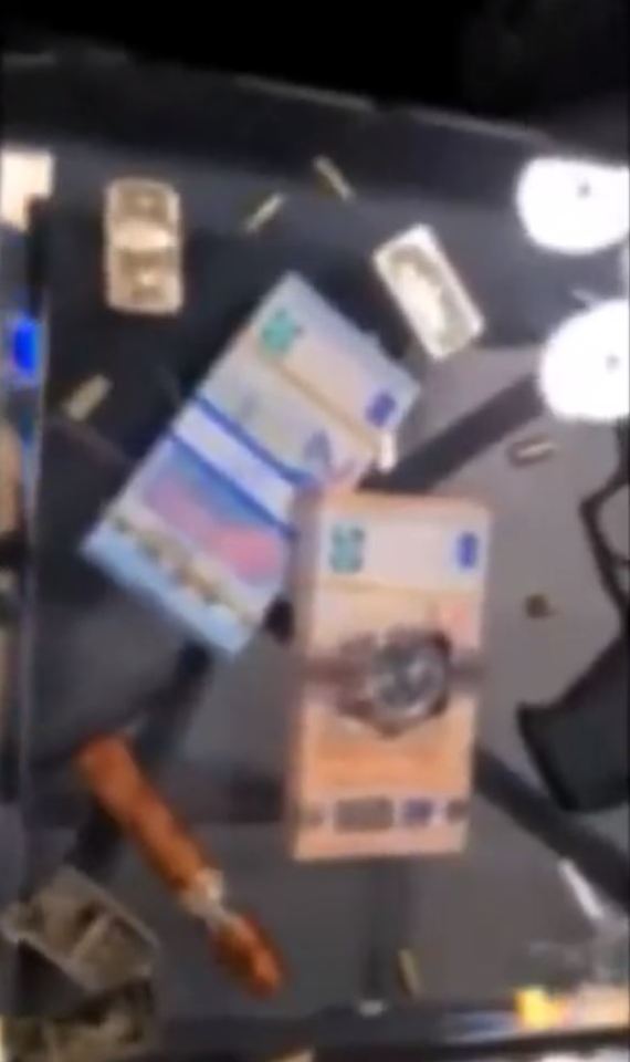 Stacks of cash can also be seen in the clip released by Romania's Directorate for Investigating Organized Crime and Terrorism