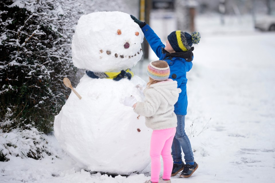 Children in Cheshire made their first snow man of the winter after the overnight deluge