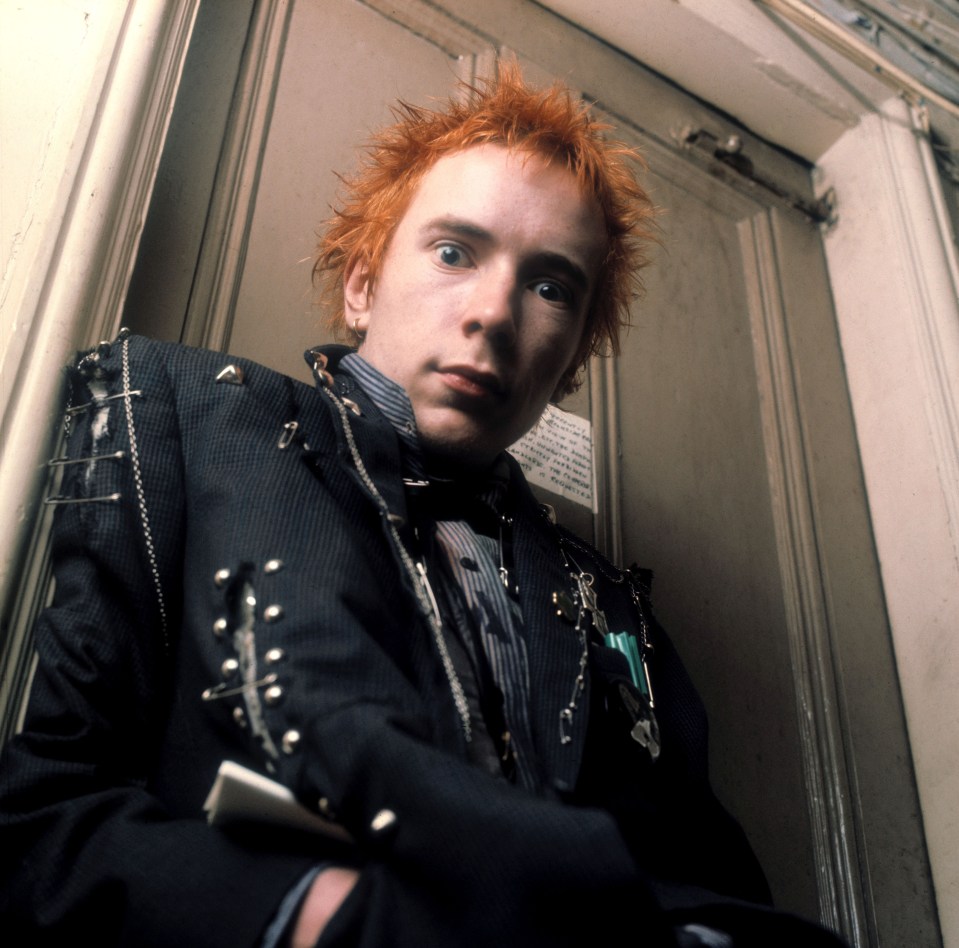 John as Johnny Rotten in the early days of Brit punk rockers the Sex Pistols - whose lyrics included  'God save the Queen, she ain’t no human being'