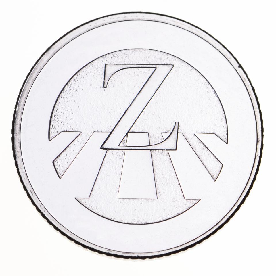 British 10p coin showing the letter Z and a zebra crossing.