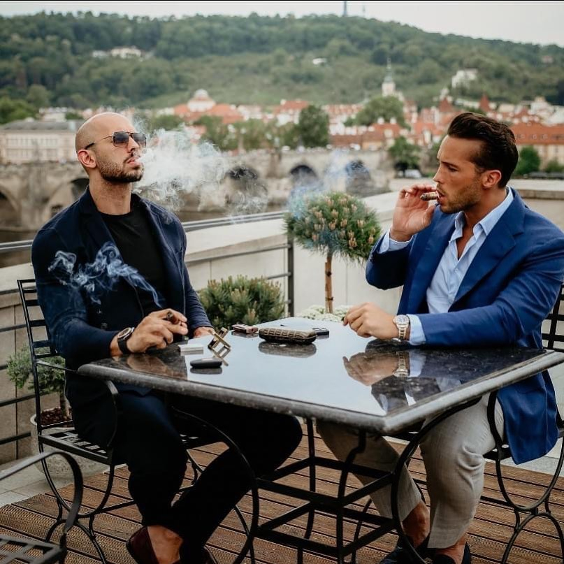 Andrew and his brother Tristan, right, were arrested in Romania last month