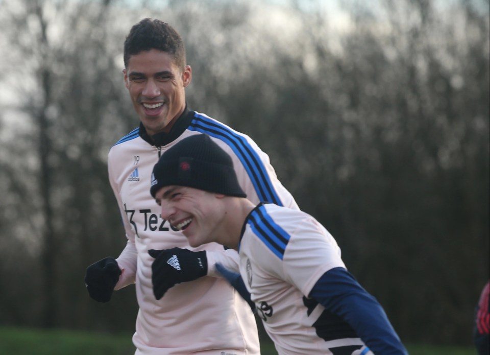 Brandon Williams shares a laugh in training with Raphael Varane