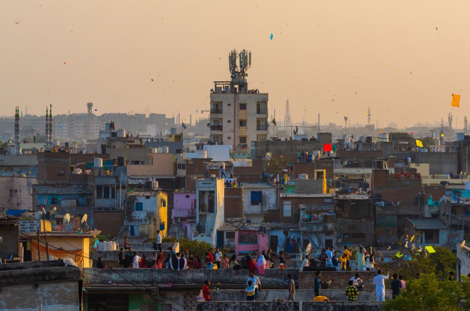 Hundreds of spectators gather on terraces to watch the spectacle in the sky