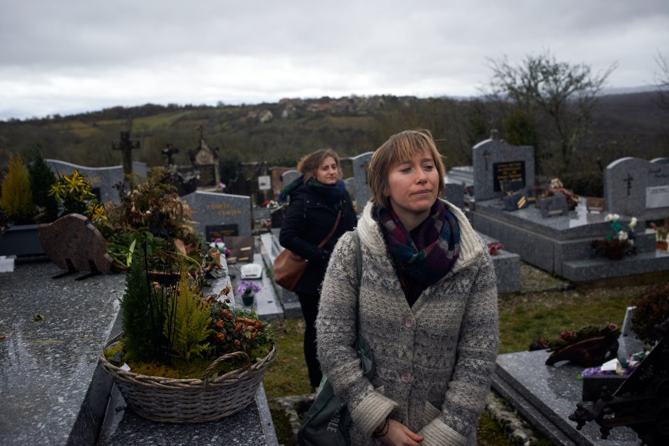 Friends Peggy and Sarah in the cemetery where Morgan is buried