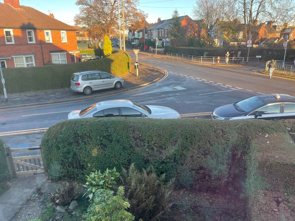 A picture taken by residents shows parents parked on the pavement or on double yellow lines