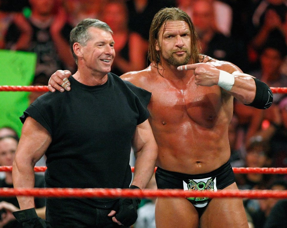 Vince McMahon pictured with WWE legend Triple H in 2009