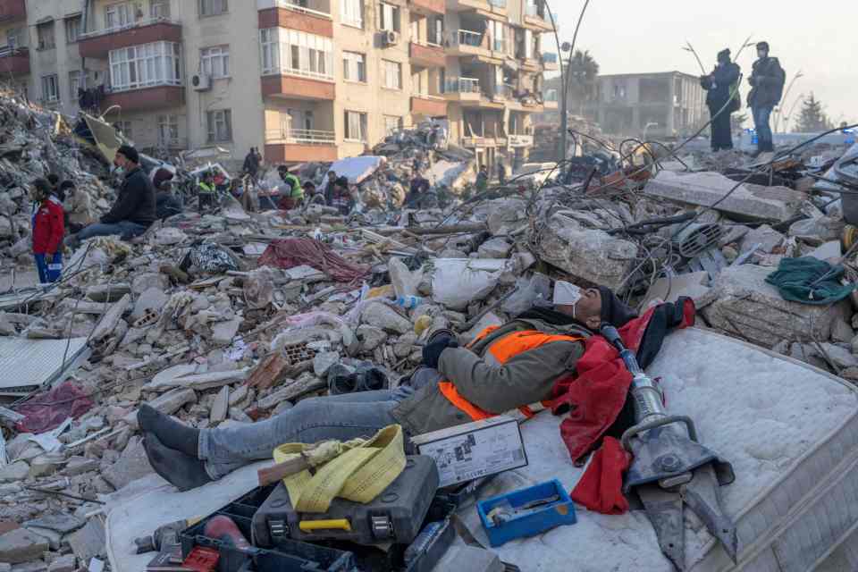 Locals are wading through heaps of rubble to find loved ones
