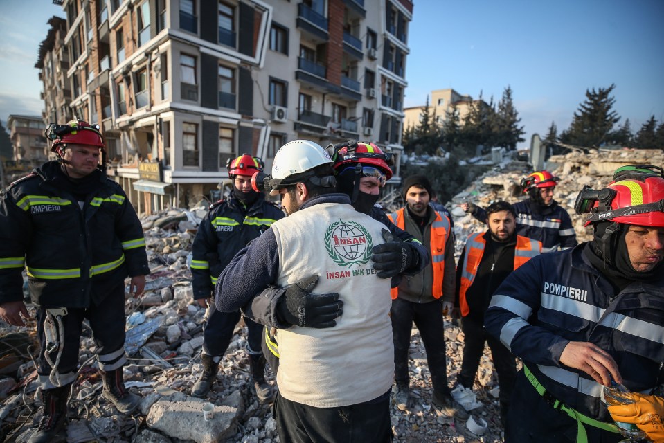 Rescue teams are working day and night to recover people trapped beneath the rubble of fallen buildings