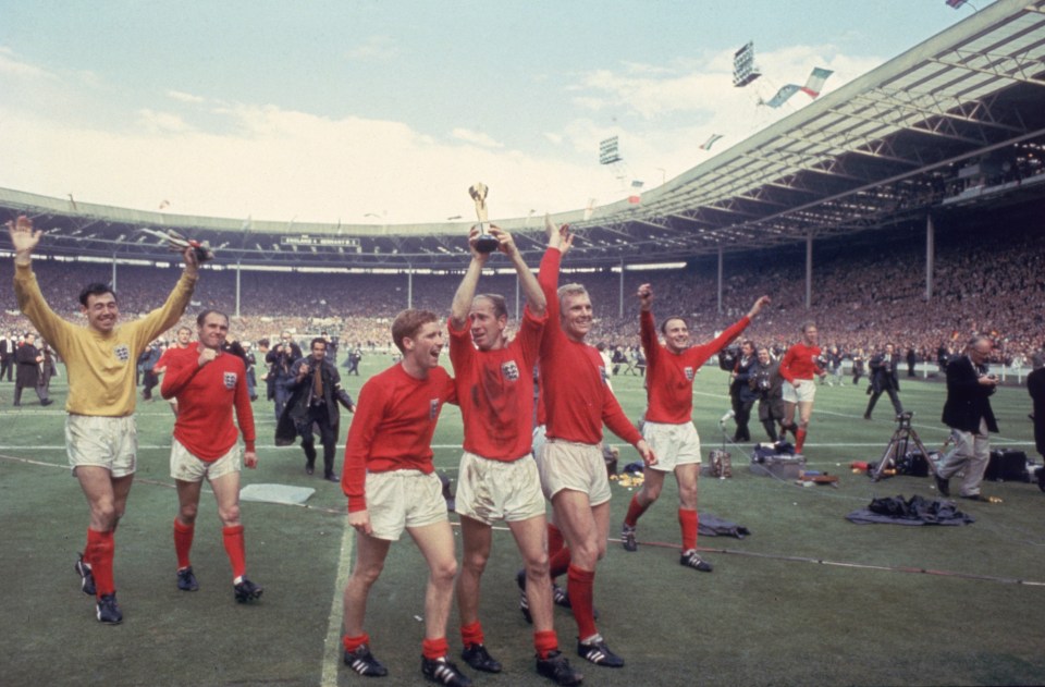 Charlton, centre, lifting the World Cup in 1966