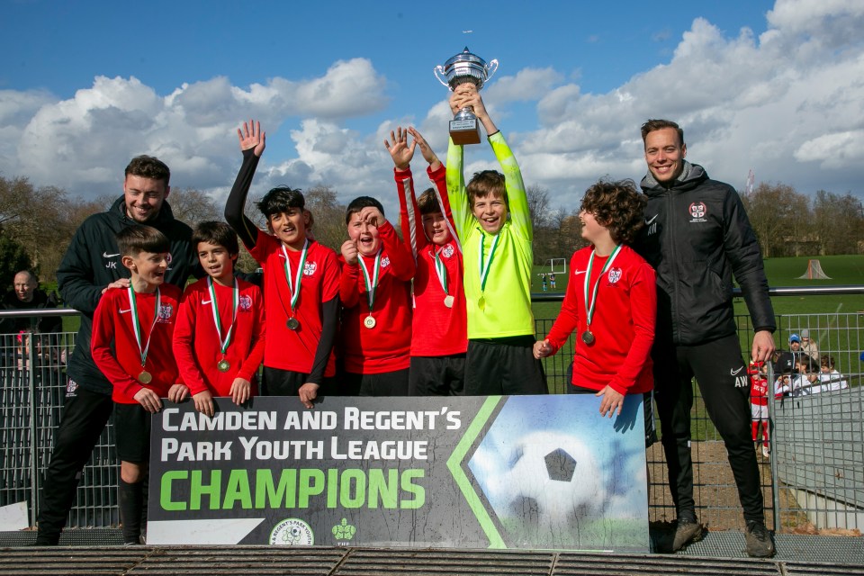 The cost of living crisis has driven more children away from clubs - here Brent Cross under-11s celebrate championship victory with head coach Jamie Kavanagh, far left