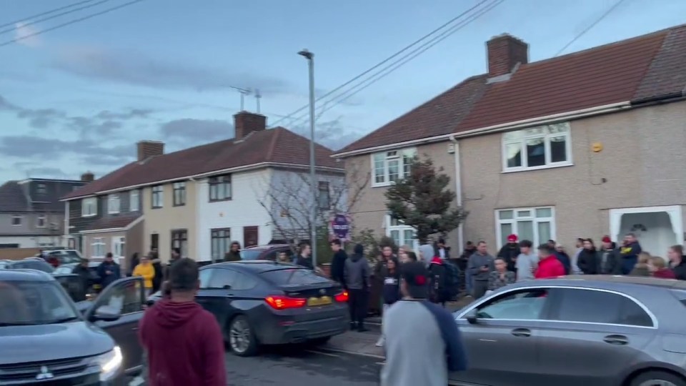 A long line of people queued up to get a look inside the terraced house in Chadwell Heath