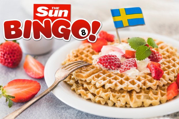 Waffles with strawberries and whipped cream, topped with a Swedish flag. The Sun Bingo! logo is in the background.