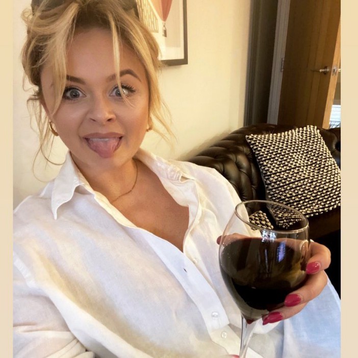Emily Atack enjoys a large glass of wine in between filming her sexy new Disney+ show with Danny Dyer