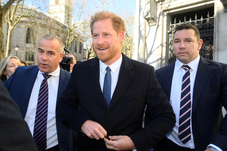 Harry fiddled with his coat buttons as he arrived to court smiling