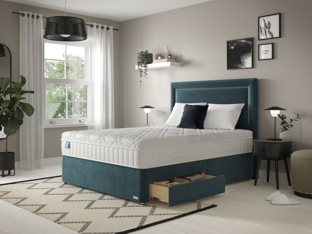 Teal divan bed with storage drawer.