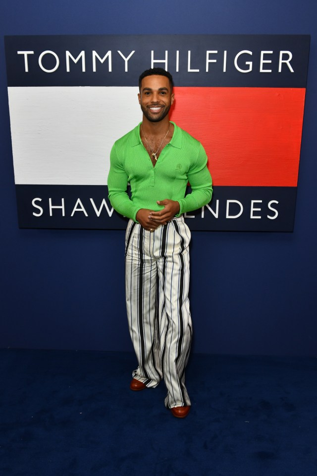 Lucien Laviscount wore this plunging green top with black and white striped trousers  to the launch of pop star Shawn Mendes’ collection with Tommy Hilfiger