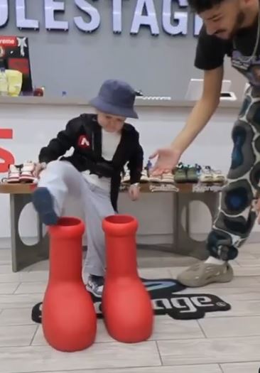 Footage showed him struggling to get into the huge shoes