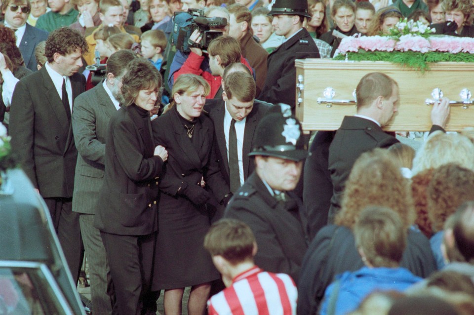 Nikki's mum Sharon Henderson weeps at her funeral
