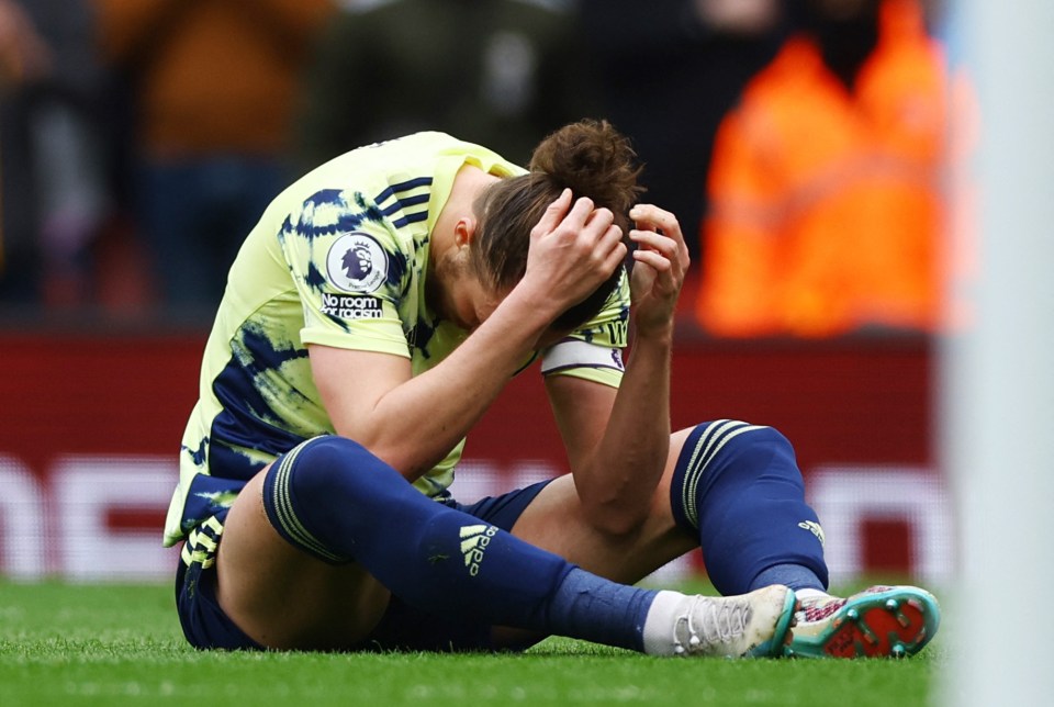 Luke Ayling hangs his head in his hands after the spot kick was given