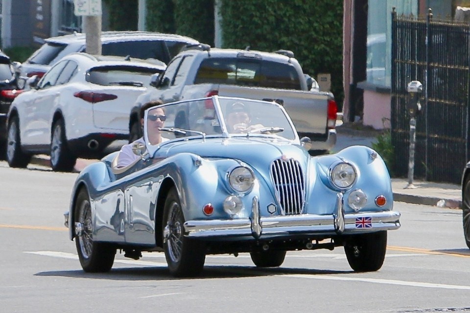 BGUK_2623474 - West Hollywood, CA - *EXCLUSIVE* - Brooklyn Beckham takes his $500k blue vintage electric Jaguar for a spin with a friend in West Hollywood. Pictured: Brooklyn Beckham BACKGRID UK 25 APRIL 2023 BYLINE MUST READ: Head to Toe Celebs / BACKGRID UK: +44 208 344 2007 / uksales@backgrid.com USA: +1 310 798 9111 / usasales@backgrid.com *UK Clients - Pictures Containing Children Please Pixelate Face Prior To Publication*
