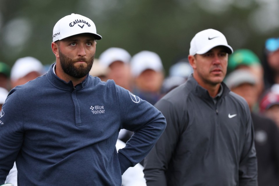 AUGUSTA, GEORGIA - APRIL 09: Jon Rahm of Spain and Brooks Koepka of the United States look on from the eighth tee during the continuation of the weather delayed third round of the 2023 Masters Tournament at Augusta National Golf Club on April 09, 2023 in Augusta, Georgia. (Photo by Andrew Redington/Getty Images)
