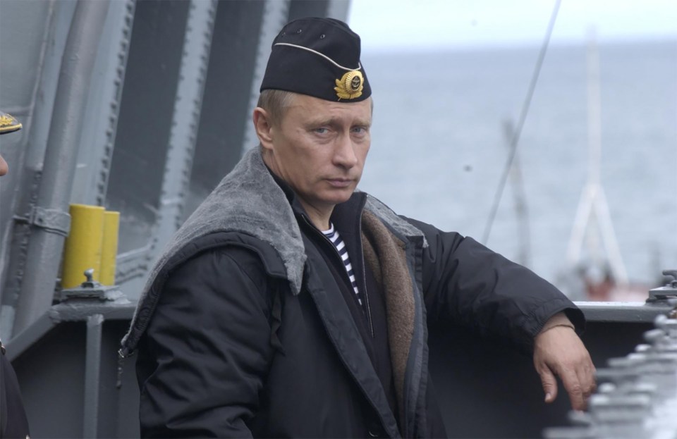 A younger Putin onboard Peter the Great in 2005 which now could be destined to become scrap metal