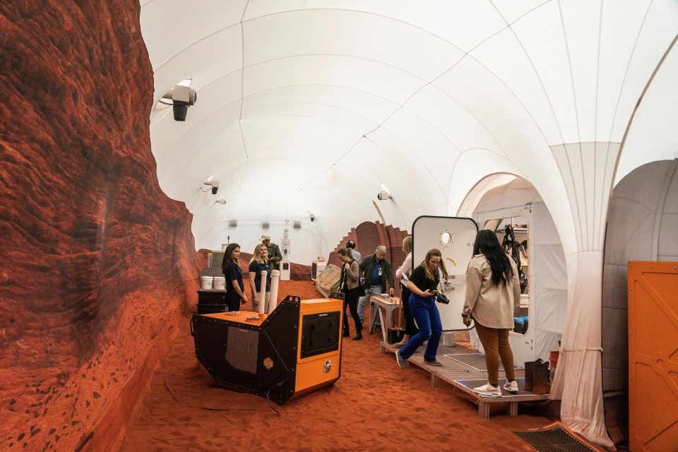 Members of the media tour inside the Mars landscape simulation area at Mars Dune Alpha, NASA's simulated Mars habitat, being used as preparations for sending humans to the Red Planet, at the agency's Johnson Space Center in Houston, Texas, U.S. April 11, 2023. REUTERS/Go Nakamura