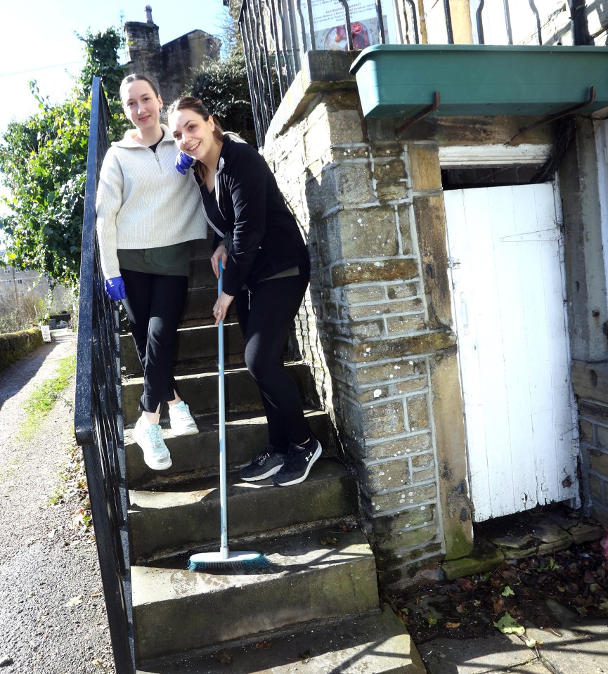 Katie Lodge and Carryn Gill of The Wrinkled Stocking Cafe sweep the steps of Compo's house in the show