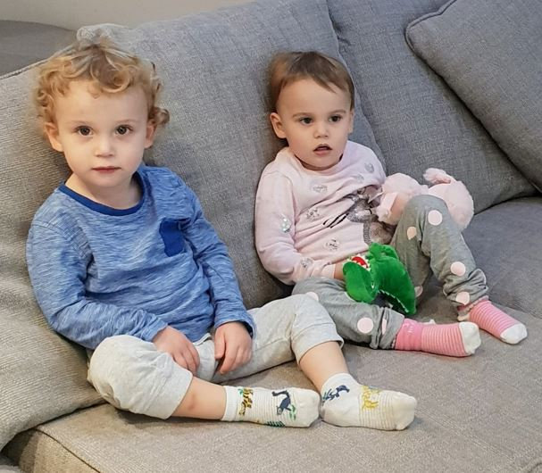 Cops found the 23-month-old twins dressed and dried in bed after Ford killed them