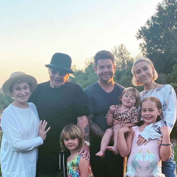 Jack Osbourne has delighted fans by sharing a rare family photo as three generations of Osbournes head off on holiday together.</p>
<p>The son of Black Sabbath rocker Ozzy, 71, also assured fans about his dad's health after he recently underwent major spine surgery and was diagnosed with Parkinson's last year.</p>
<p>For his latest Instagram post, Jack, 34, posed up with his famous parents Ozzy and Sharon - who haven't been seen for months - and his three kids Andy Rose, Minnie Theodora and Pearl, who he shares with ex wife Lisa Stelley.</p>
<p>Jack's girlfriend Aree Gearhart completed the happy line-up.