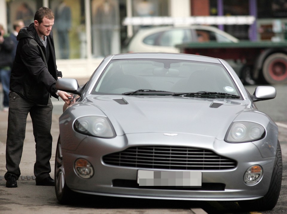 The former England captain filling up his Aston Martin Vanquish S