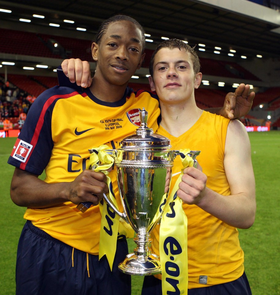 Sanchez Watt and Jack Wilshere proudly held the youth cup after a 6-2 aggregate win over Liverpool
