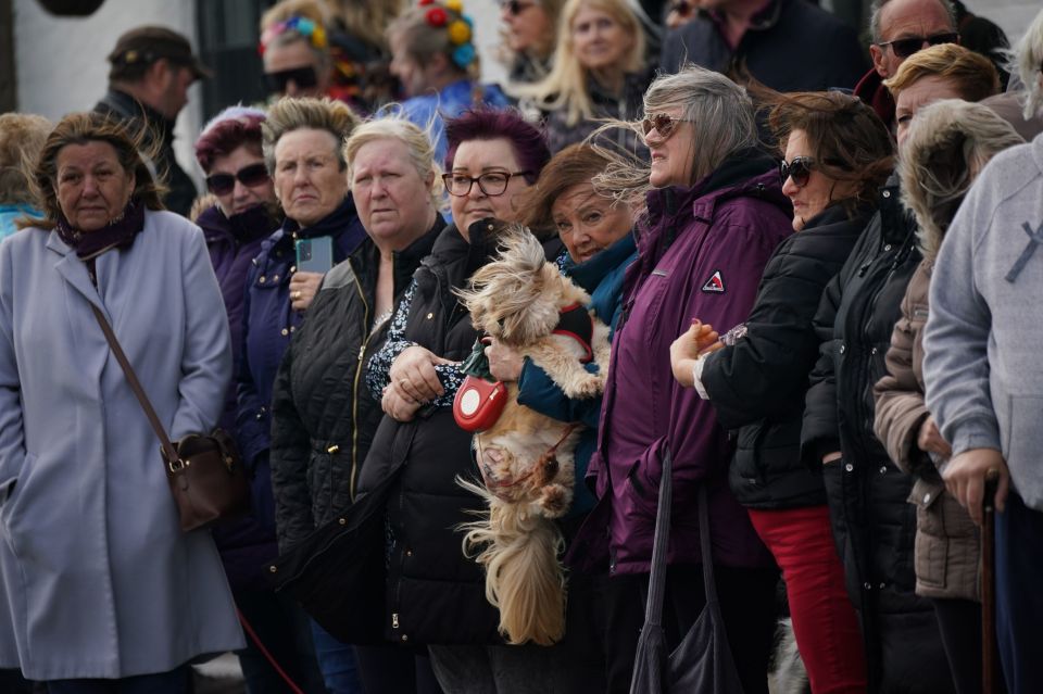The fans - and their dogs - braved the winds to say their goodbyes