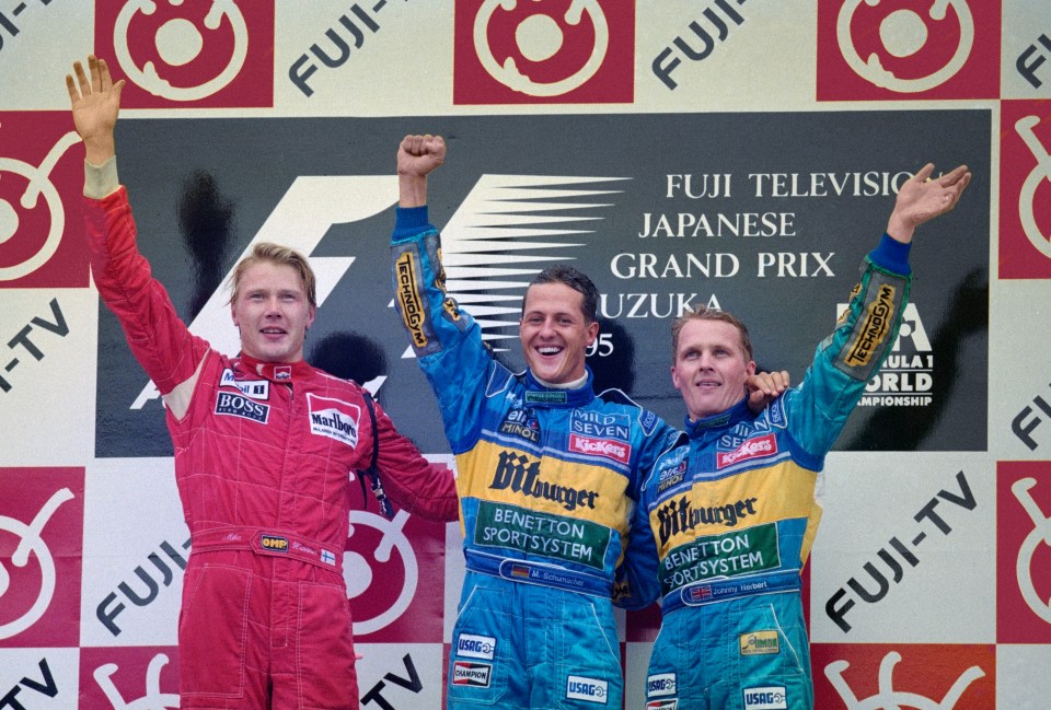 Michael Schumacher (centre) and British F1 driver Johnny Herbert (right) raced on the now-defunct Benetton team together between 1994 and 1995