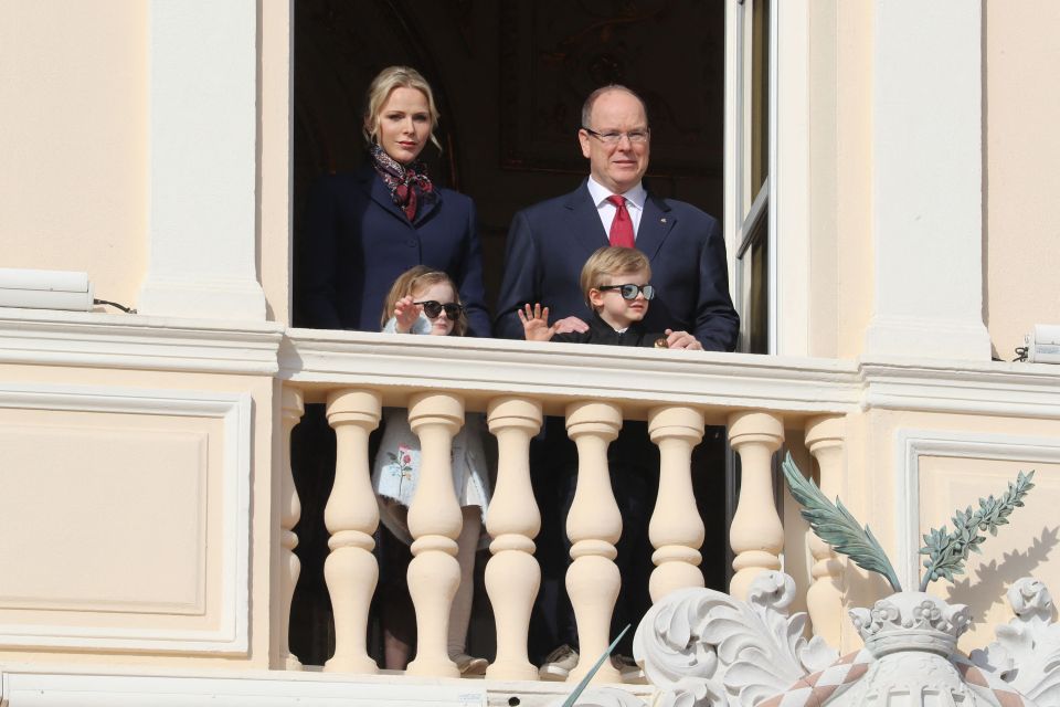 The Monegasque Royal Family using their balcony to pose for photos with the public