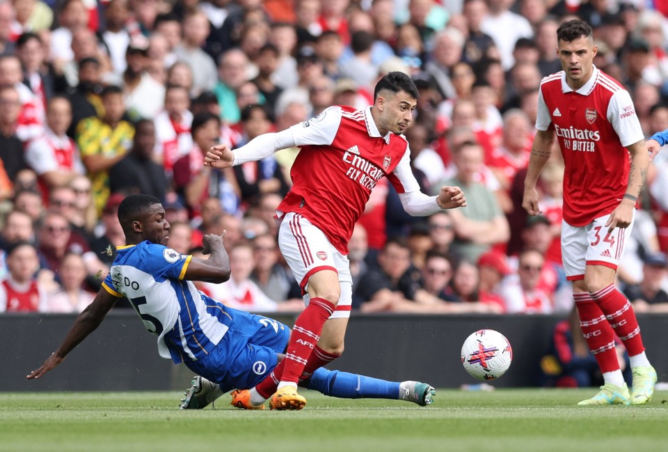 Martinelli was forced off injured following this challenge from Moises Caicedo