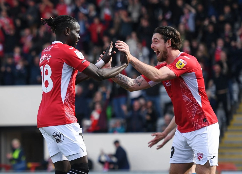 Oumar Niasse celebrates his only goal for Morecambe alongside Cole Stockton