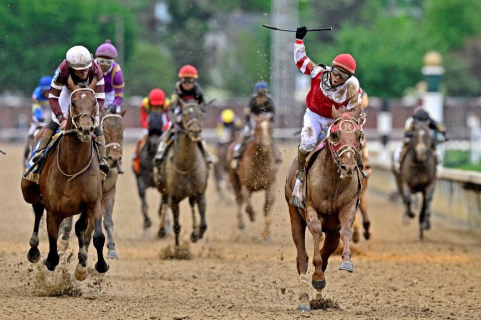 May 7, 2022; Louisville, KY, USA; Sonny Leon aboard Rich Strike celebrates winning the 148th running of the Kentucky Derby at Churchill Downs. Mandatory Credit: Jamie Rhodes-USA TODAY Sports TPX IMAGES OF THE DAY