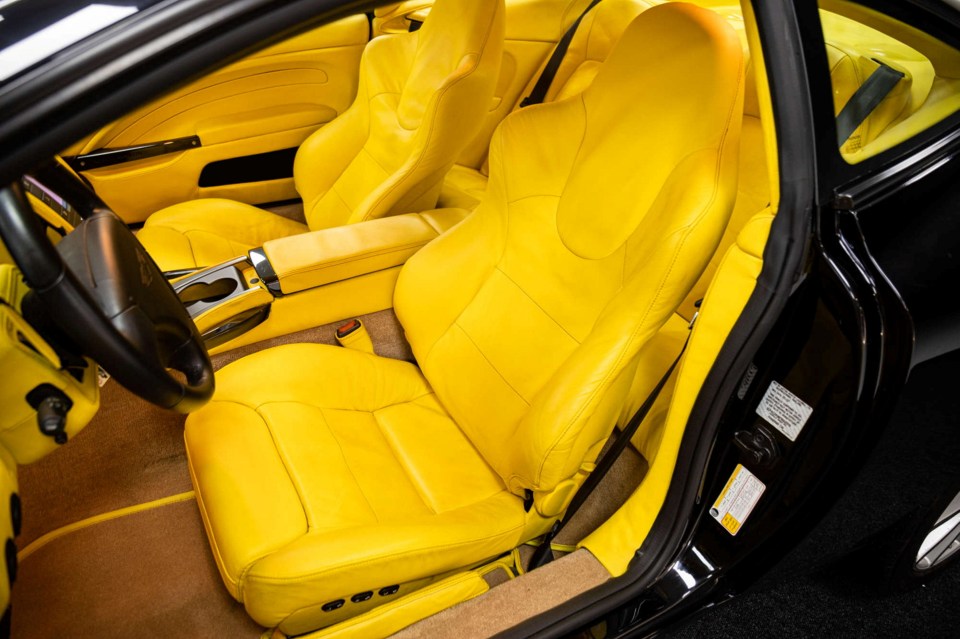 THIS PICTURE: 2007 Aston Martin V12 Vanquish S 2+2 Ultimate Edition - Unregistered - 522km - guide price £150,000 - £170,000 --- SEE SWNS STORY SWNAcars --- A sleek Aston Martin with an eye-popping interior is a highlight of an unusual car auction. The sale features dream cars that have very low mileage - including a 2007 Vanquish in shocking yellow. The V12 Ultimate Edition - guide price £150,000 - £170,000 - has only 522 kilometres on the clock. It was purchased by an anonymous owner and put on private display for fifteen years.
