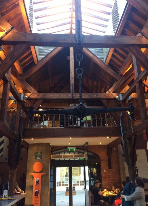 Inside wooden beams hang from the restaurant's ornate wooden ceiling